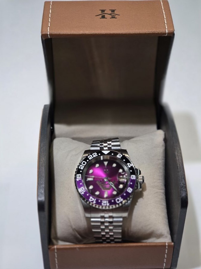 A Hill Timepieces watch in its leather box